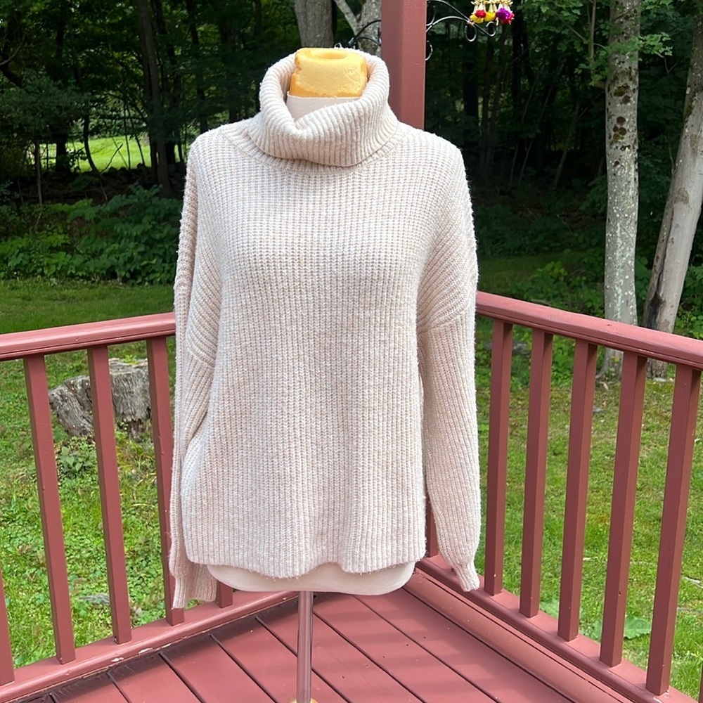 Esqualo large turtle neck knit sweater.